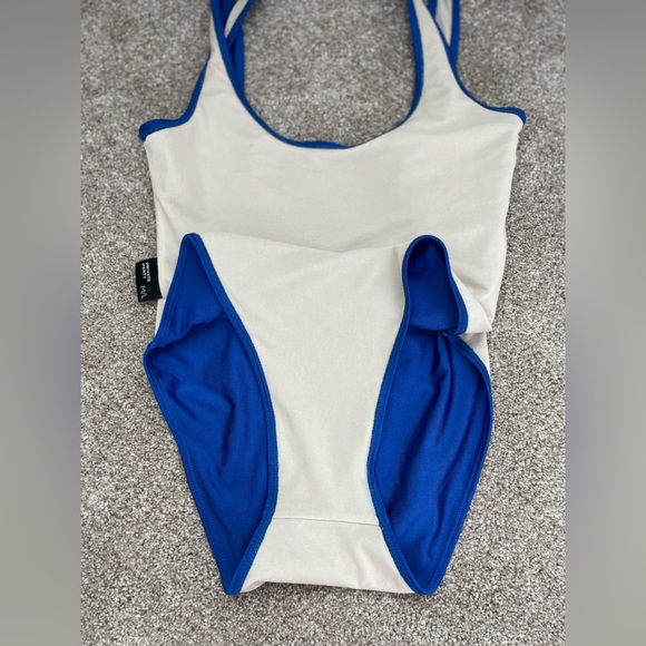 Blue one piece swimsuit with saying, “you do you boo boo,” in white letters. - Picture 4 of 5